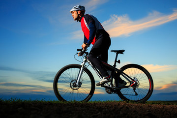 Obraz na płótnie Canvas Cyclist Riding the Bike