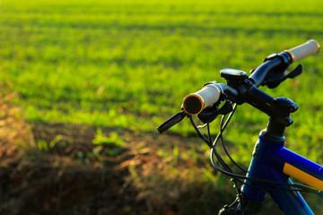 Obraz na płótnie Canvas Beautiful close up scene of bicycle at sunset,