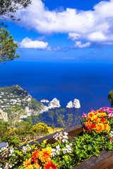 Obraz premium Capri Island Campania Italy. High angle viewpoint of Faraglioni rocks with scenic coastline sea view. Famous Mediterranean destination luxury fine art asset