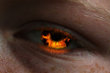 girls eye with burning fire in it 