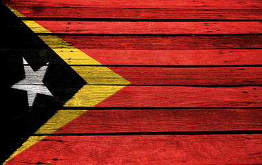 Naklejka premium East Timor flag on wood