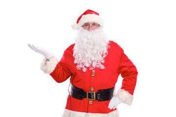 Kind Santa Claus pointing in white blank sign, isolated on white background