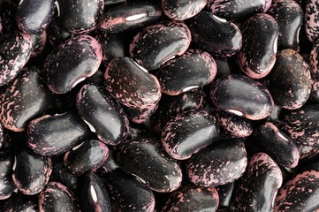 Raw whole colorful black and pink beans pattern