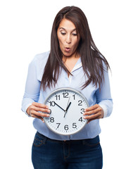 woman holding clock