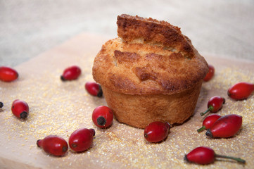 Cornbread with red dog roses decoration , freshly baked .
