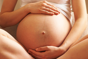 Fototapeta na wymiar Pregnant woman at home