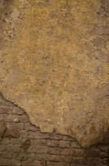 Clay brown wall of the old house. Textured background