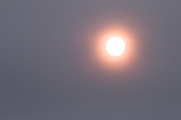 The sun is blocked by smoke