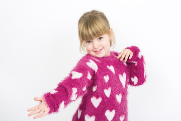 Little girl smiling with pink jersey