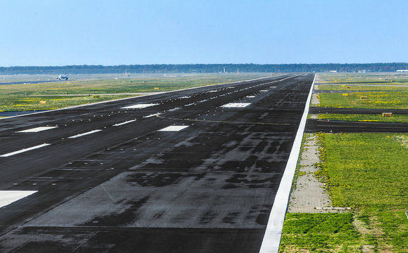 wet runway at airport just before take off