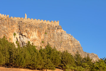 Fototapeta na wymiar Medieval fortifications on top of the rock in Lindos .