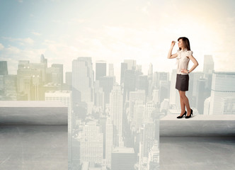 Businesswoman standing on the edge of rooftop
