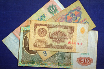 Paper Soviet money: 1, 3, 10, 50 rubles.