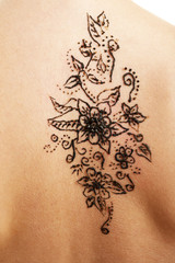 Fototapeta na wymiar Back painted with henna- Mehendi, close up