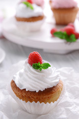 Delicious cupcake with berries on table close up
