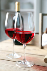 Still life of wine and bread on light background