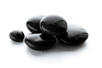 Wet spa stones isolated on white