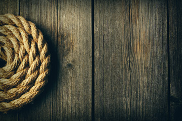 Fototapeta premium Rope over wooden background