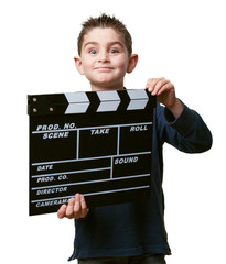 little kid holding a clapper