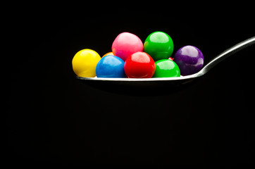 Gumballs on a spoon