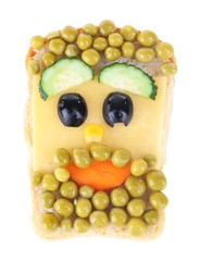 Creative sandwich for a child with funny face isolated on white background