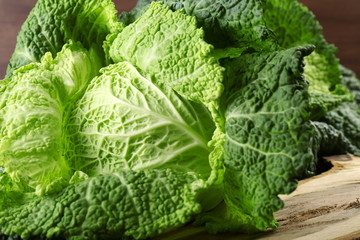 Savoy cabbage on cutting board closeup