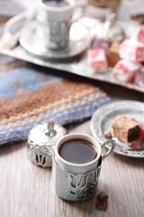 Antique tea-set with Turkish delight on table close-up
