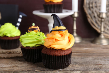 Halloween cupcakes on wooden table