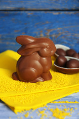 Easter chocolate bunny and eggs on wooden background