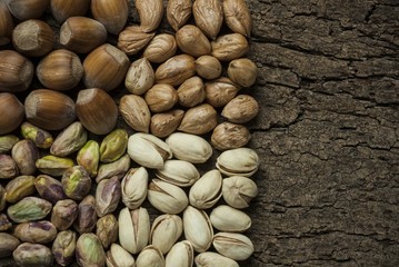 Composition with nuts, hazelnuts and pistachios close up