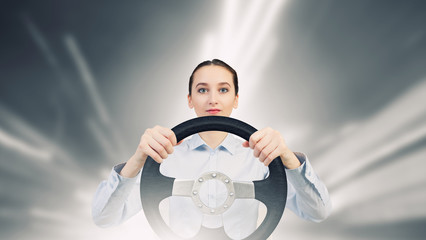 Woman with steering wheel