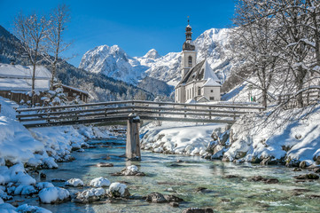 Idyllic mountain winter landscape with famous church and crystal clear river in Ramsau, Berchtesgadener Land, Bavaria, Germany