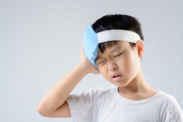 Boy headache and ice gel pack