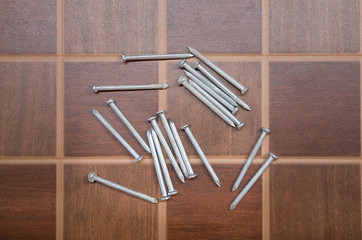 Tacks on tile floor