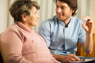 Doctor talking with senior woman