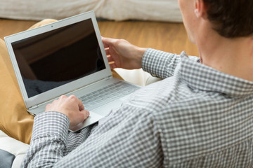 Male designer working on laptop