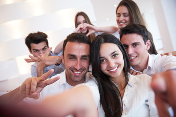 group of friends taking selfie