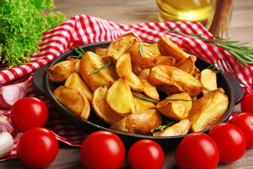 Baked potato wedges on table, closeup