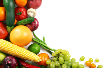 Heap of fruits and vegetables isolated on white