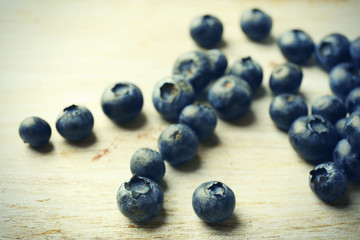 Fresh blueberries on wooden table close up