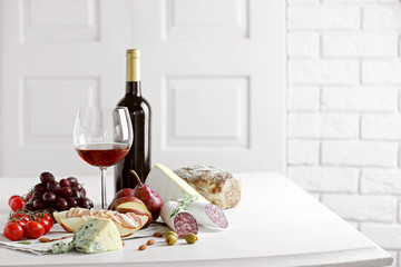 Still life with various types of Italian food and wine