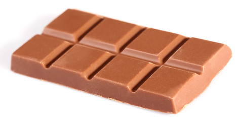 Milk chocolate pieces isolated on white background