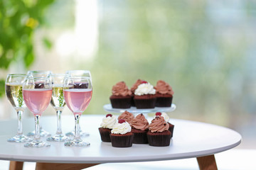 Tasting of wine and chocolate cupcakes, close up