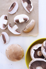 Sliced and whole fresh mushrooms.