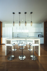 Bar stools by modern kitchen