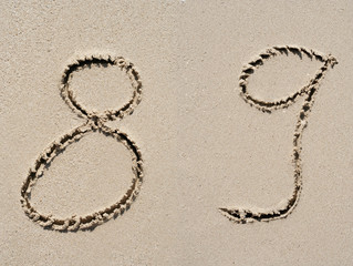 Sand font or number set or collection on an exotic beach near the sea in summer