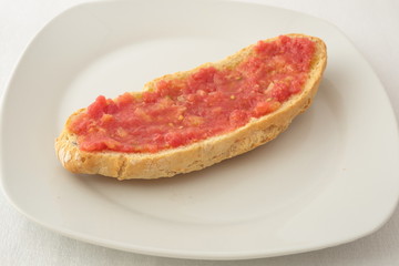 slice of bread with grated tomato