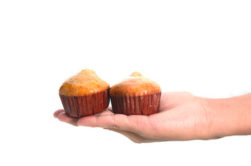 banana cake in hand isolated on white