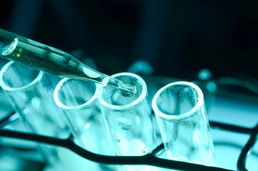 Test tubes closeup on blue background.