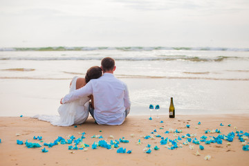 Just married couple drinking champagne at sea. selective Focus
